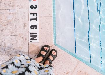 photo of feet in nuvo suites rooftop pool