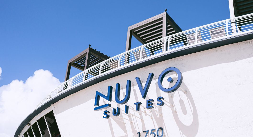 view of building with cabanas of the pool