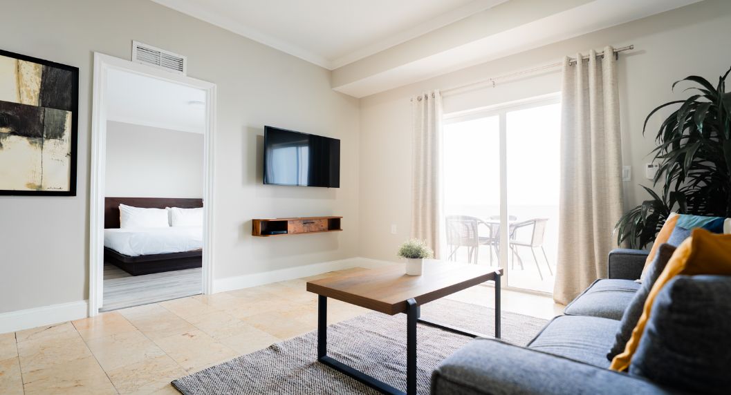 view of the master king suite living room, master bedroom and balcony