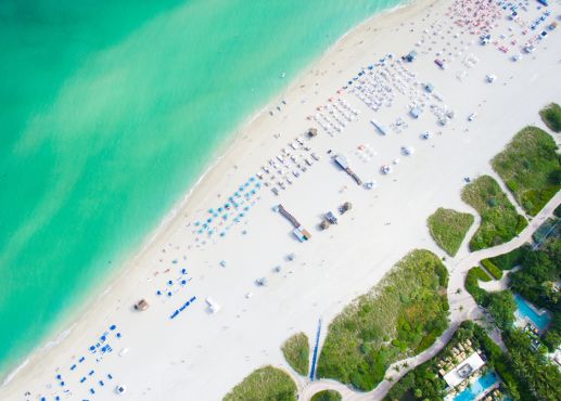 miami beach aerial view of sand and blue water